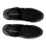 Slip-on in pelle con zeppa